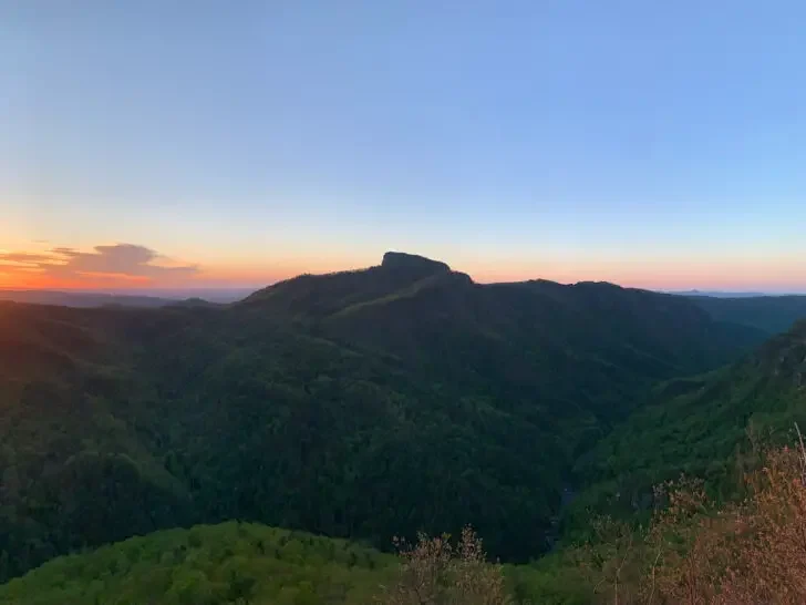 places to visit in November USA view of mountains at sunset with pink and blue sky