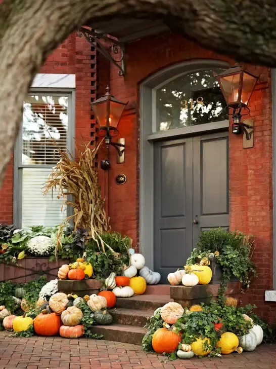 front porch with multi colored pumpkins for fall