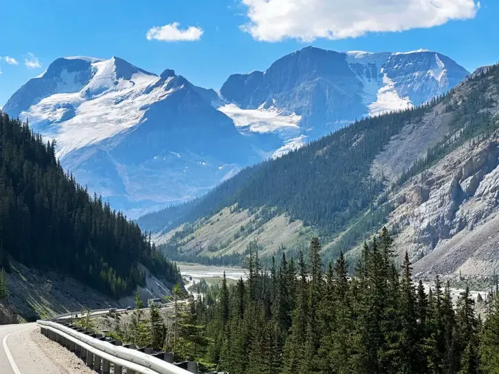 Banff summer vacation view of road through mountains with snow and valley