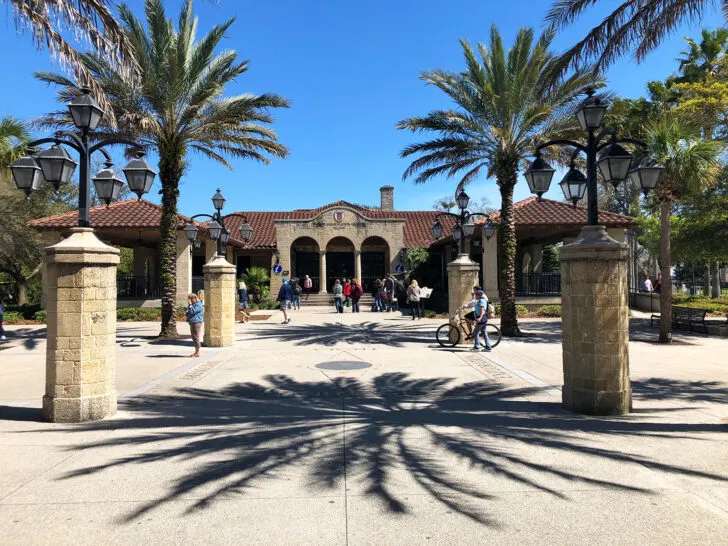 warm places in winter USA view of building and palm trees with people and palm tree shadow