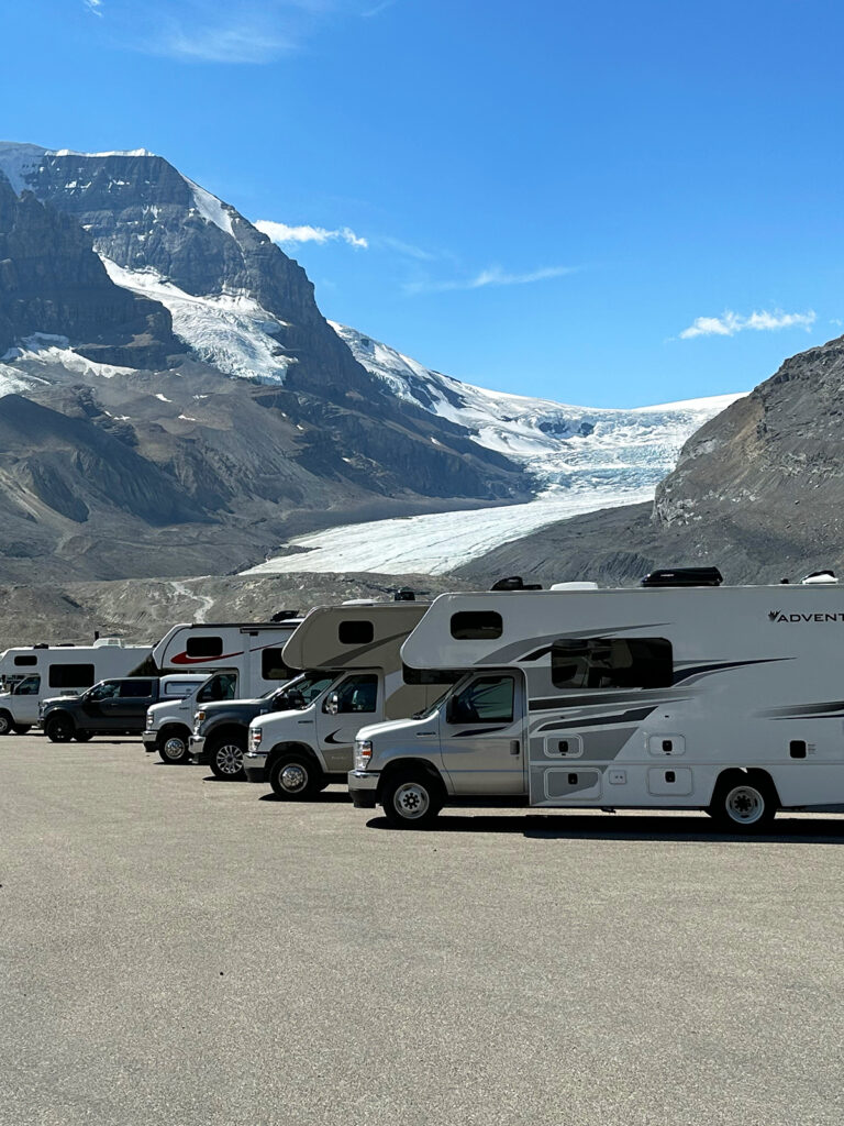 banff to jasper highway RVs lined up with mountain and glacier in distance