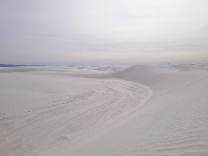 warm winter vacations in the US view of white sands as far as the eye can see with white sky near sunset