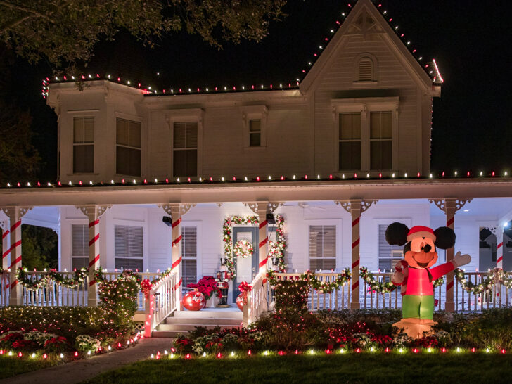 best warm winter destinations in USA view of house decorated with lights and inflatable Mickey Mouse