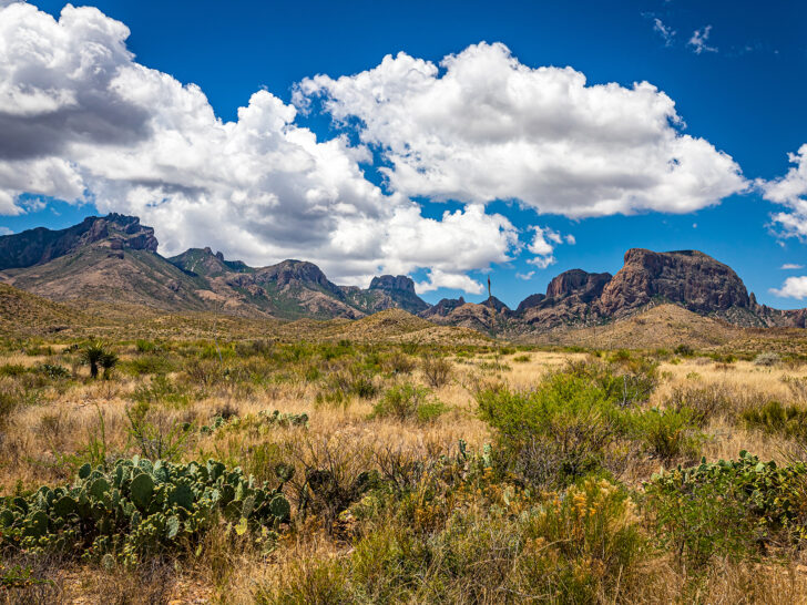 cheap warm winter vacations USA view of national park Texas with mountains and puffy clouds