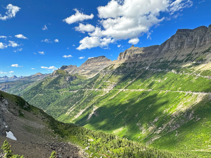 planning a trip to glacier national park amazing view with green mountainside on sunny day