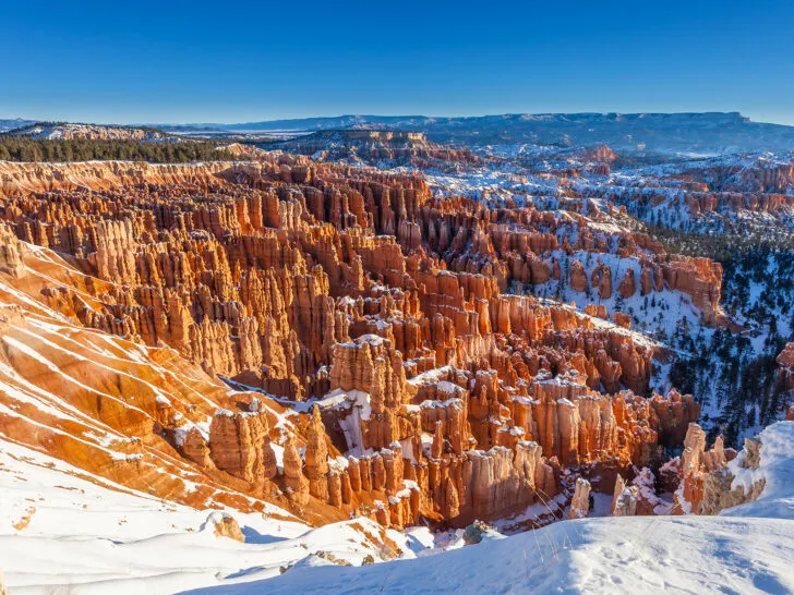 road trips in the winter view of orange spires and rock valley with snow in Utah
