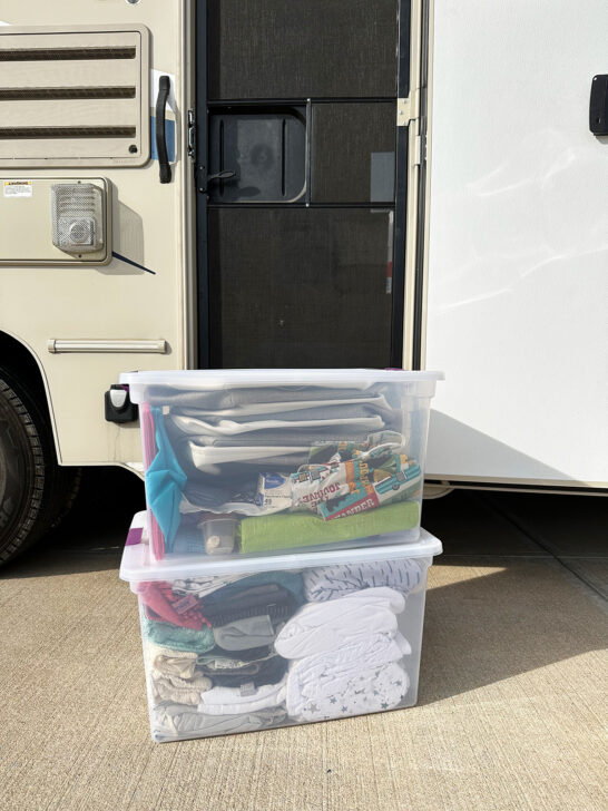 camping RV checklist view of storage tubs in front of motorhome