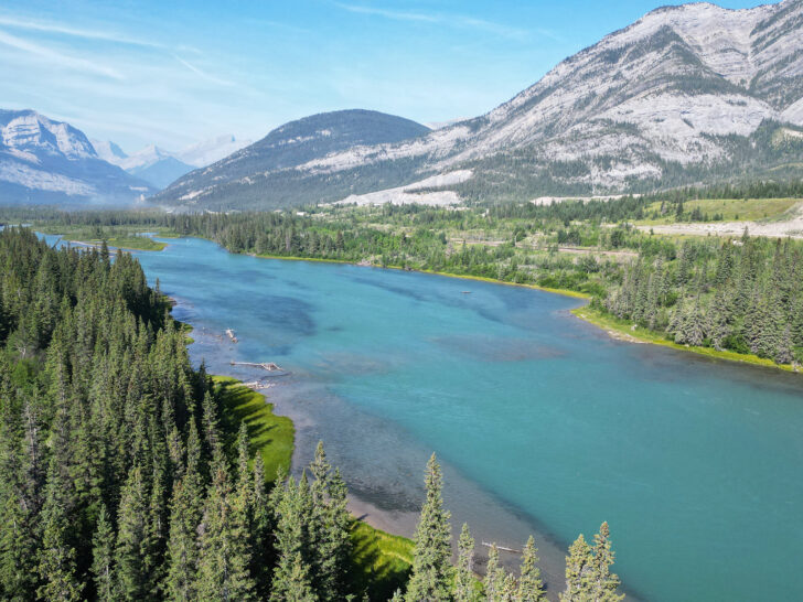 7 days in the Canadian rockies view of teal river with trees and mountains surrounding it