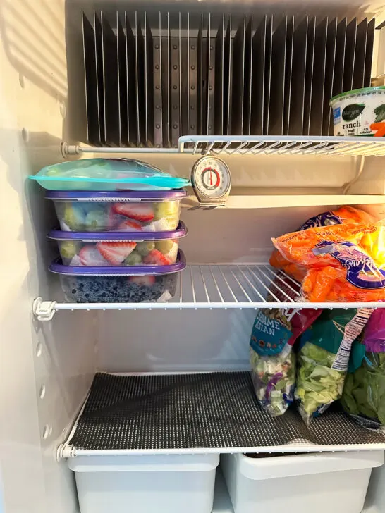 food prepped in fridge with view of non-slip mat for camper tips