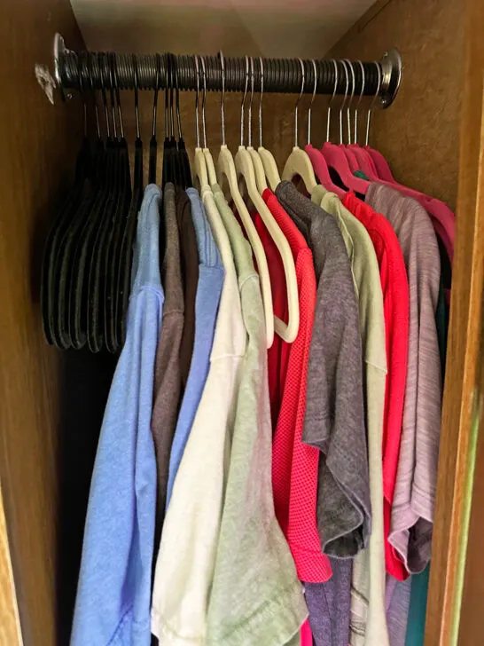 camper tips and tricks for organization shirts hanging in closet with thin hangers