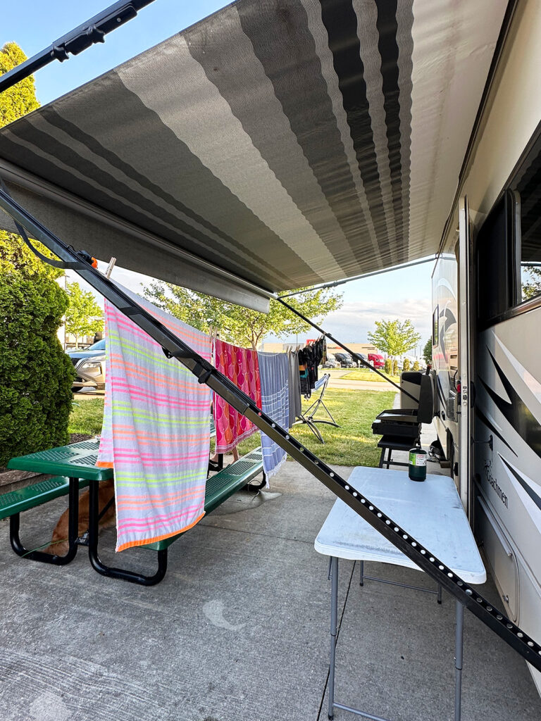 towels hanging on clothesline on exterior of RV for best camper tips and tricks