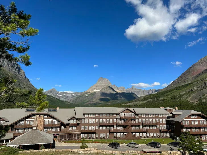 view of large hotel in picturesque mountain setting glacier national park