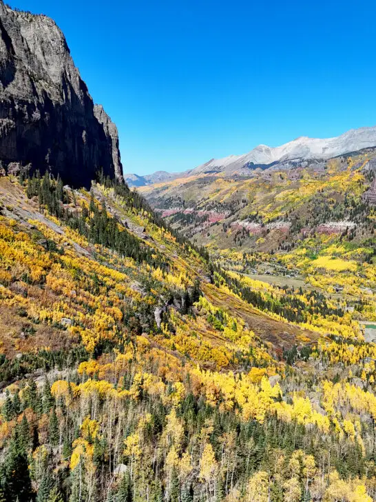 late September in Telluride Colorado view of yellow and green trees in the mountains